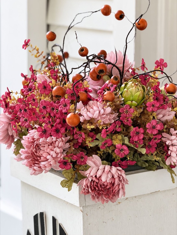 Purple and Pink and Orange Front Porch Decorated With Pumpkins